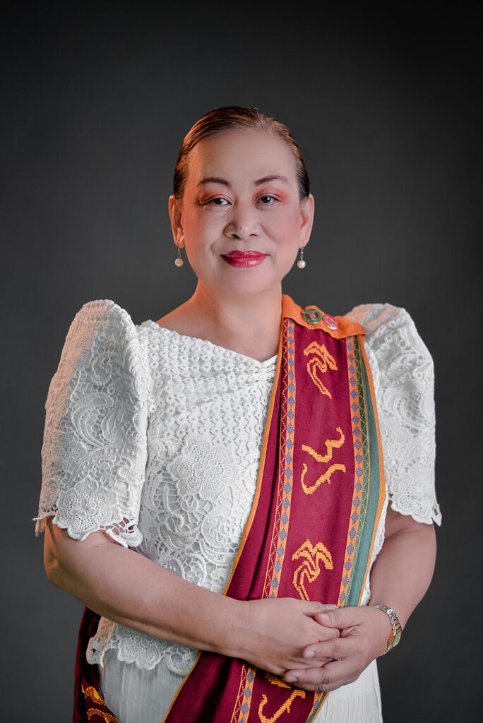 An image of Prof. Barroga-Jamias in formal wear, wearing a Sablay.